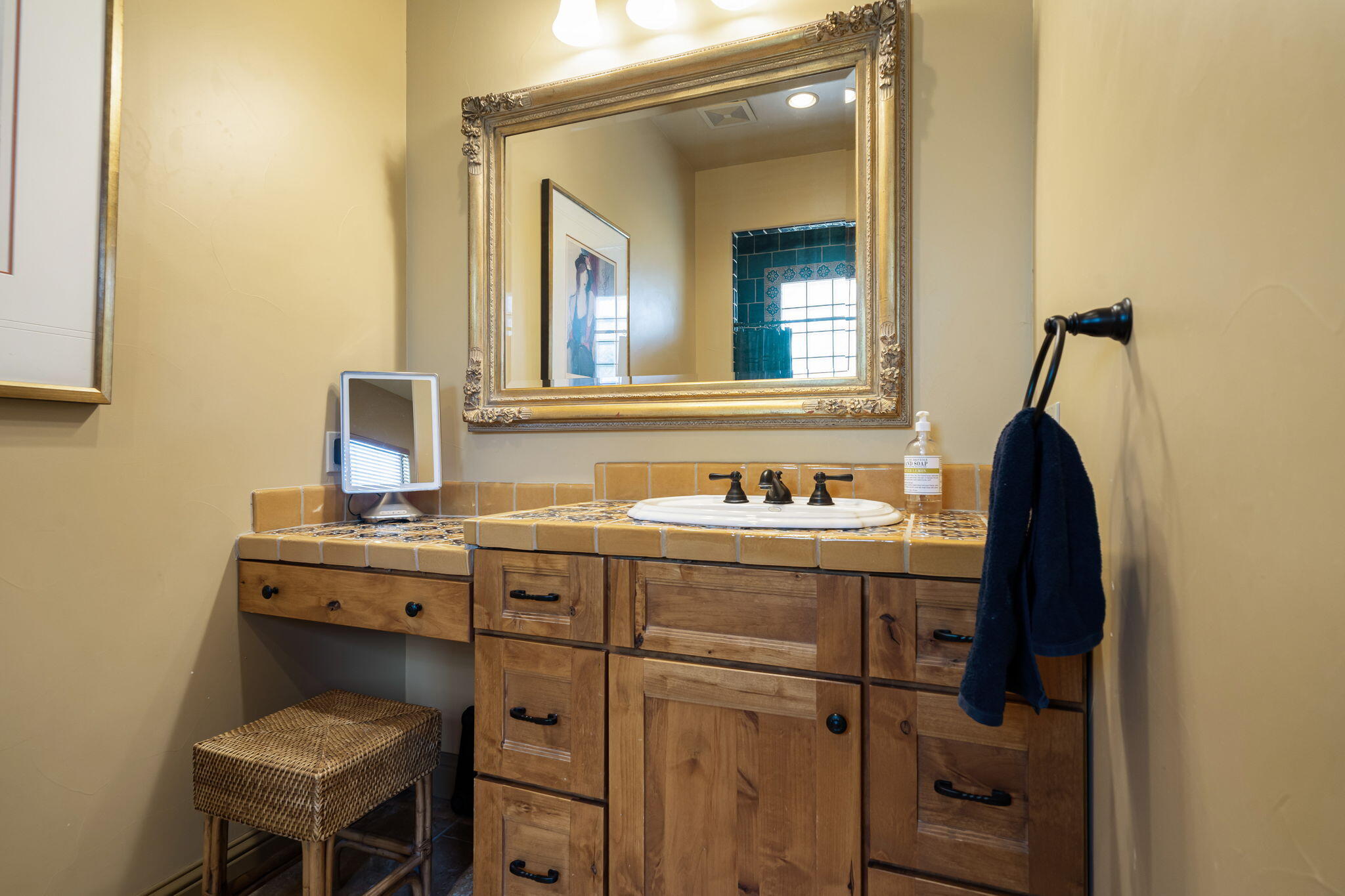 42590 Sandy Bay Road Bermuda Dunes, CA 92203 - Photo 37 of 45 a bathroom with a sink vanity and mirror