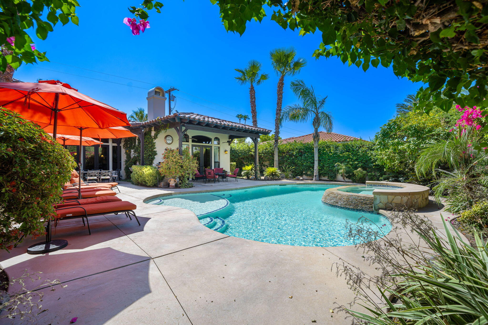 42590 Sandy Bay Road Bermuda Dunes, CA 92203 - Photo 4 of 45 a front view of a house with garden