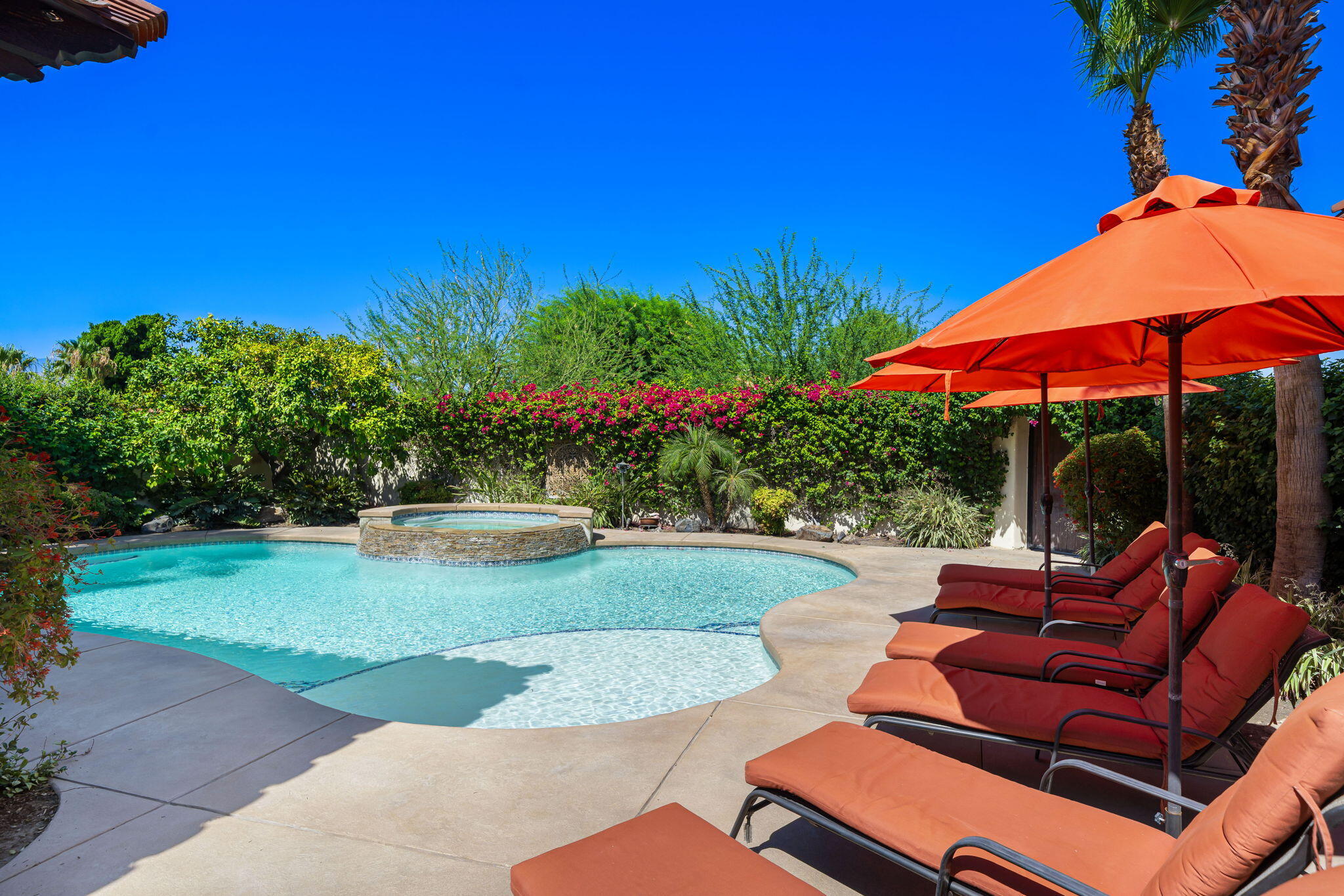 42590 Sandy Bay Road Bermuda Dunes, CA 92203 - Photo 6 of 45 a view of a backyard with sitting area