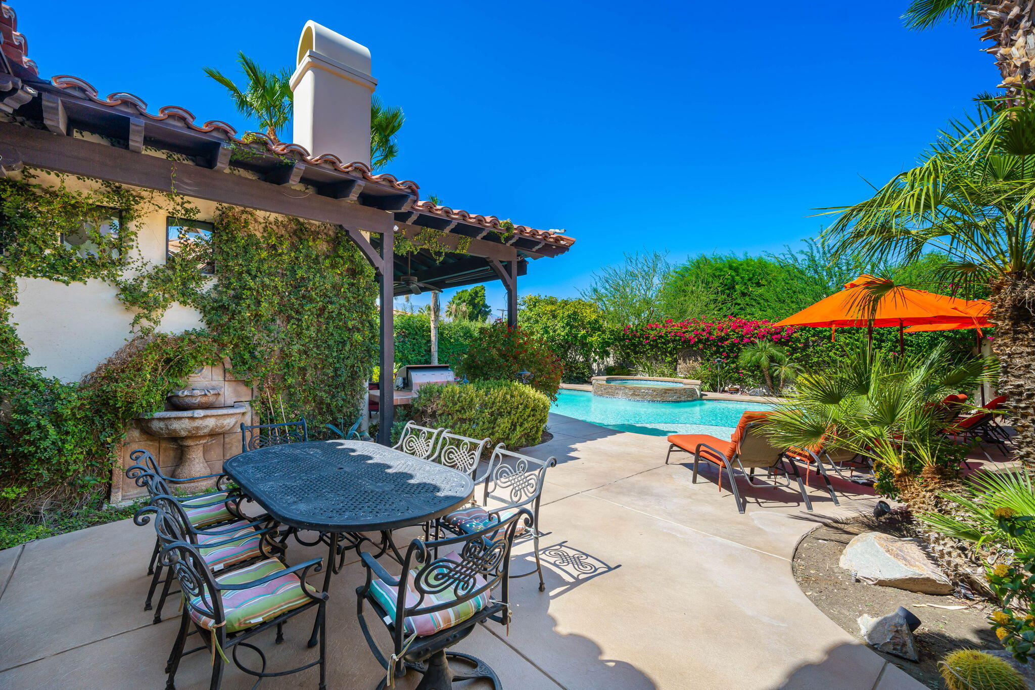42590 Sandy Bay Road Bermuda Dunes, CA 92203 - Photo 10 of 45 a view of a table and chairs under an umbrella in patio
