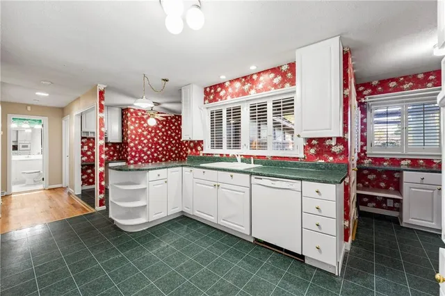 a bathroom with a sink a toilet and bathtub