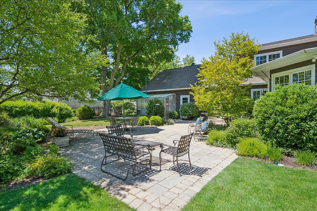 253 Summerfield Road Northbrook, IL 60062 - Photo 37 of 46 a view of a chair and table in backyard of the house