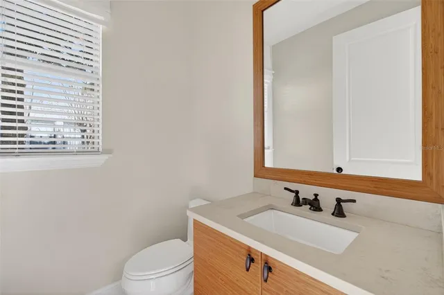 a bathroom with double vanity sinks and a shower