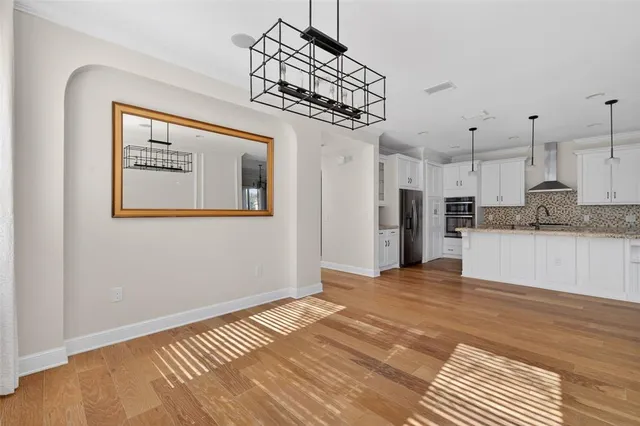 a view of a hallway with windows