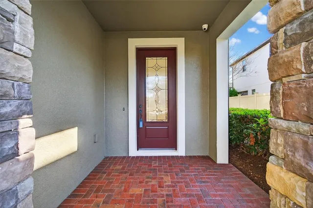 a view of a hallway with wooden floor and entryway