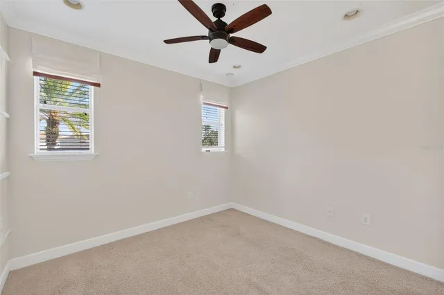 an aerial view of a residential houses with outdoor space and lake view