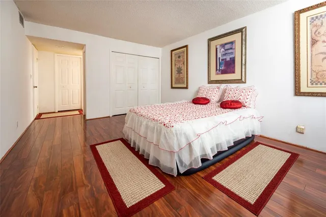 a bedroom with a bed and a table