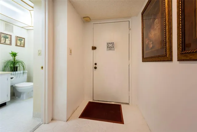 a room with a toilet and a shower