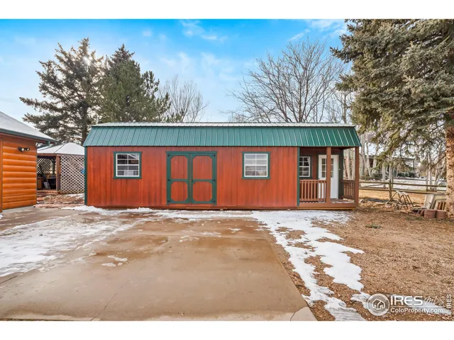 a dining hall view with a large dining table and chairs with wooden floor