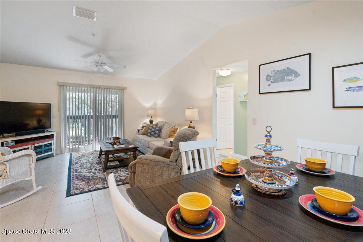 7667 North Wickham Road, Unit 916 Melbourne, FL 32940 - Photo 12 of 53 a living room with furniture and a flat screen tv