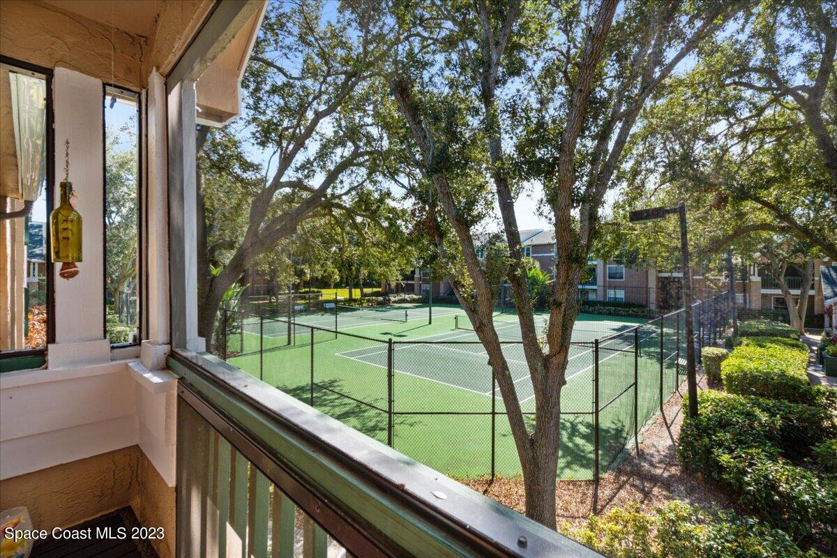 7667 North Wickham Road, Unit 916 Melbourne, FL 32940 - Photo 22 of 53 a view of backyard with green space and seating