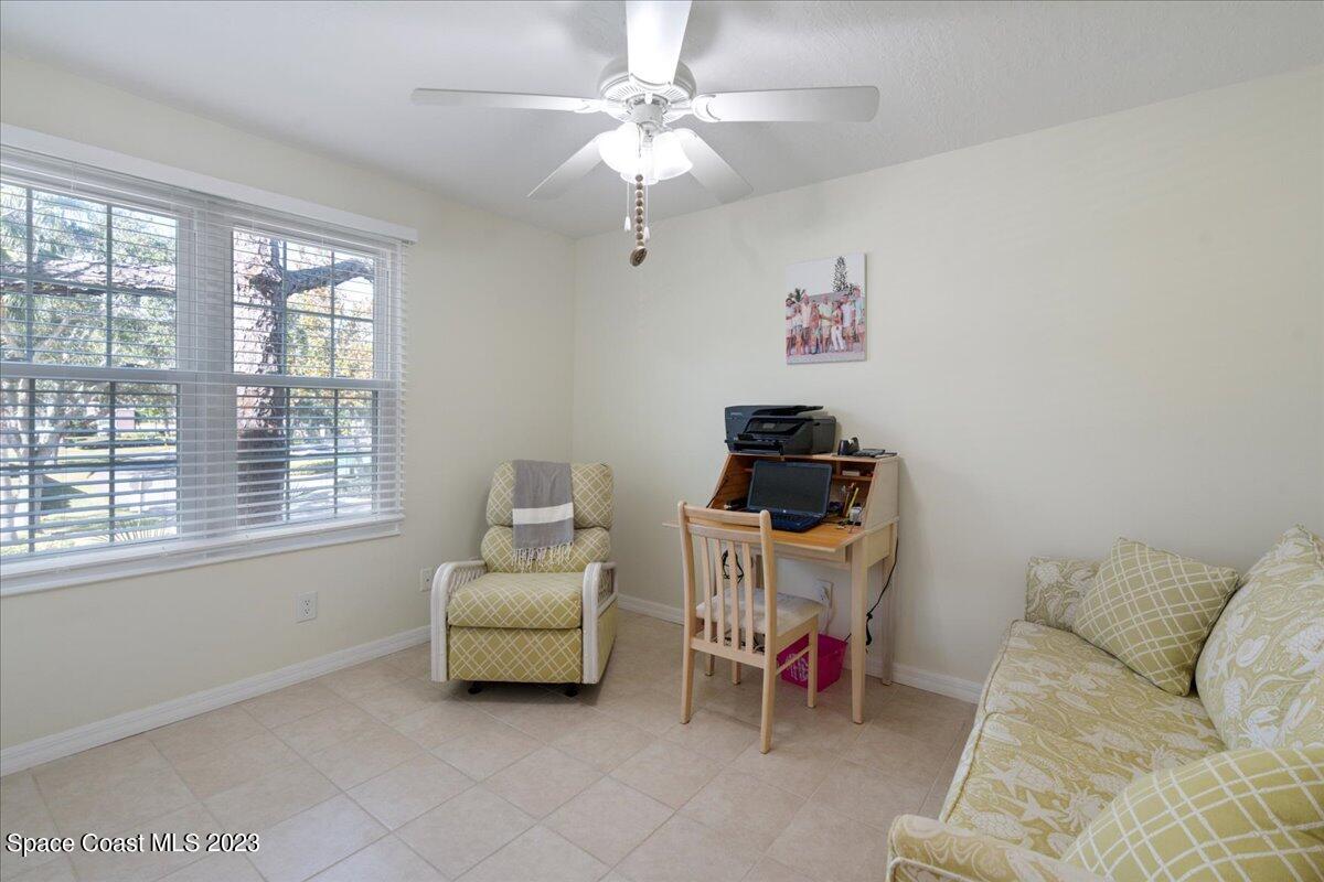 7667 North Wickham Road, Unit 916 Melbourne, FL 32940 - Photo 37 of 53 a living room with furniture and a window
