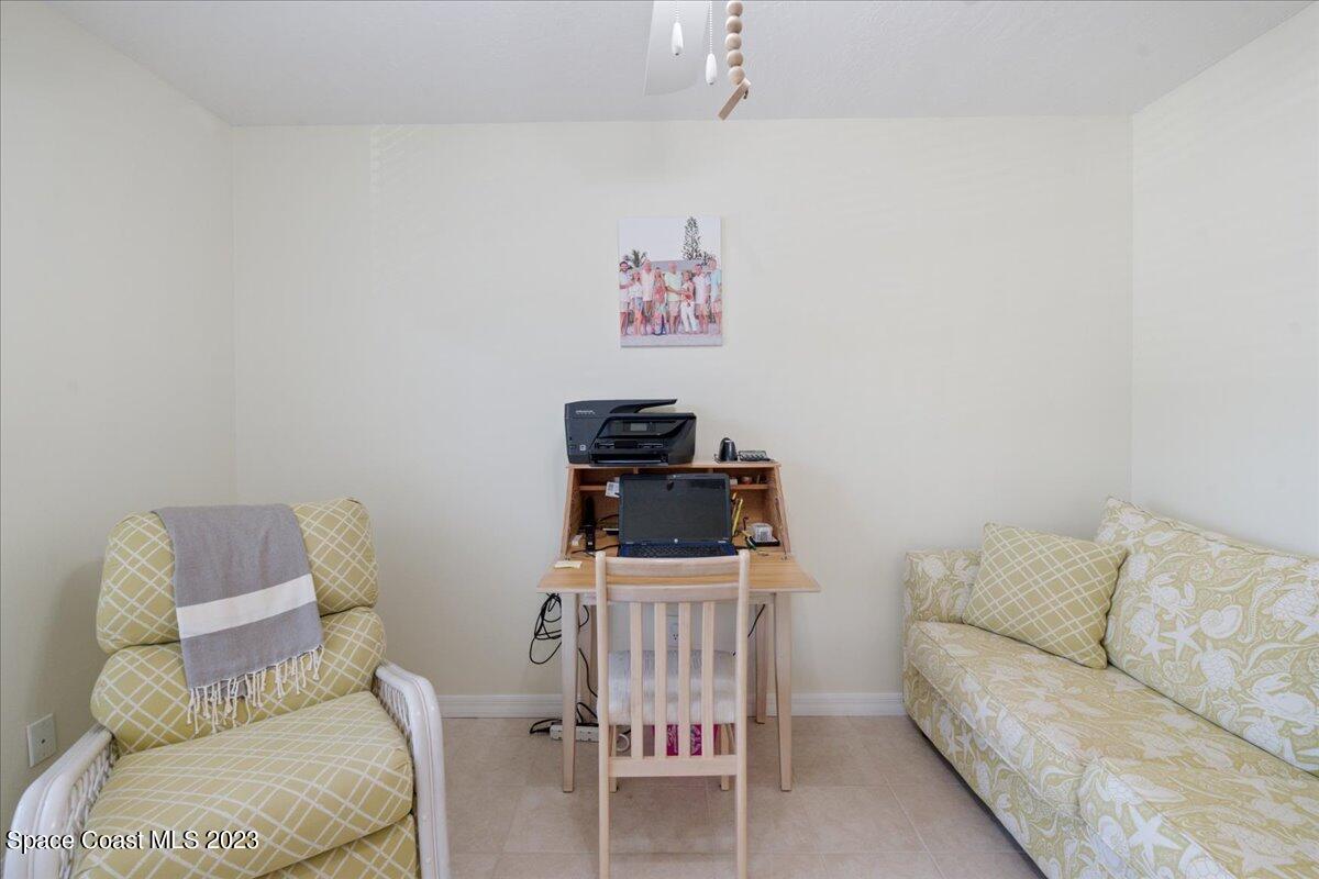 7667 North Wickham Road, Unit 916 Melbourne, FL 32940 - Photo 38 of 53 a living room with furniture and a couch