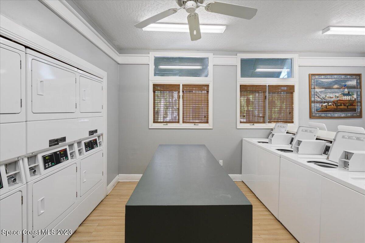 7667 North Wickham Road, Unit 916 Melbourne, FL 32940 - Photo 46 of 53 a kitchen with white cabinets and window