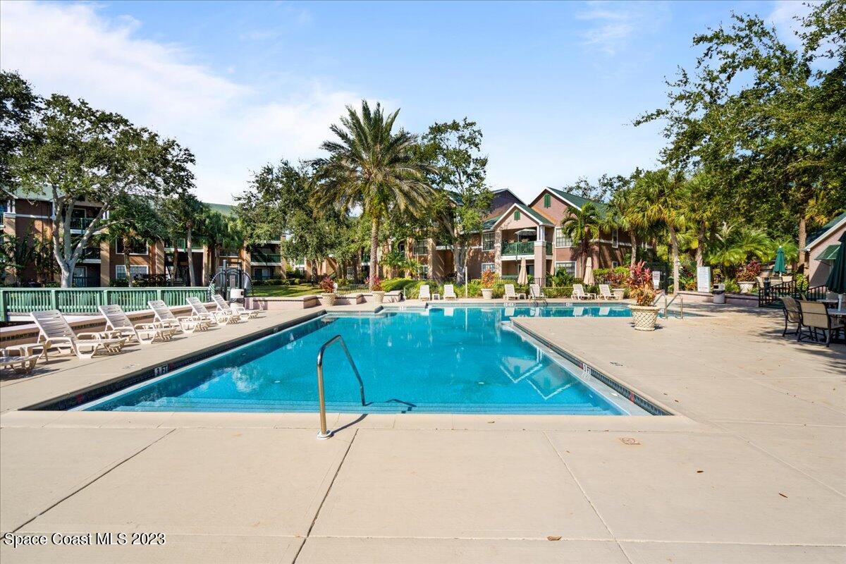 7667 North Wickham Road, Unit 916 Melbourne, FL 32940 - Photo 52 of 53 a view of outdoor space with swimming pool and lounge chair