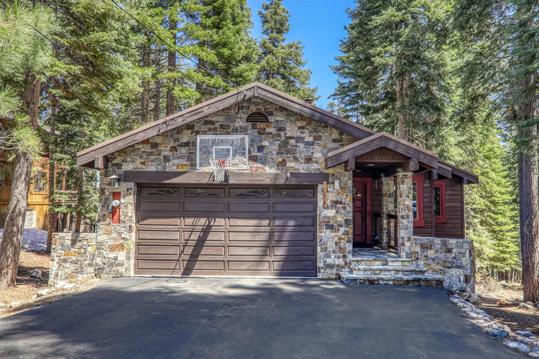 12209 Greenleaf Way Truckee, CA 96161 - Photo 2 of 28 a front view of a house with a garage