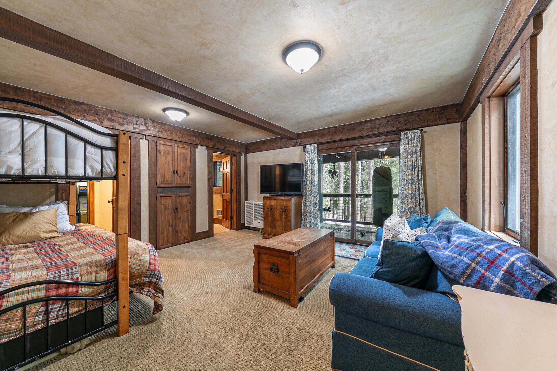 12209 Greenleaf Way Truckee, CA 96161 - Photo 22 of 28 a bedroom with furniture and large windows