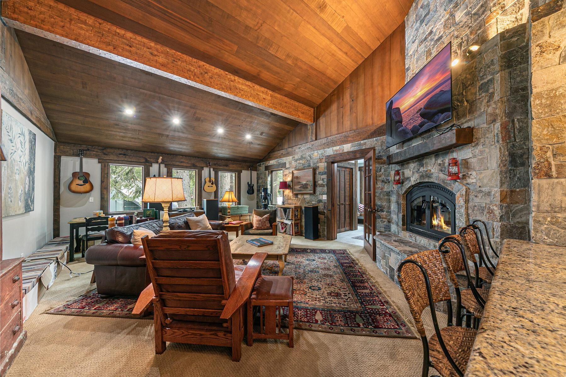 12209 Greenleaf Way Truckee, CA 96161 - Photo 6 of 28 a view of a livingroom with furniture a fireplace and large windows