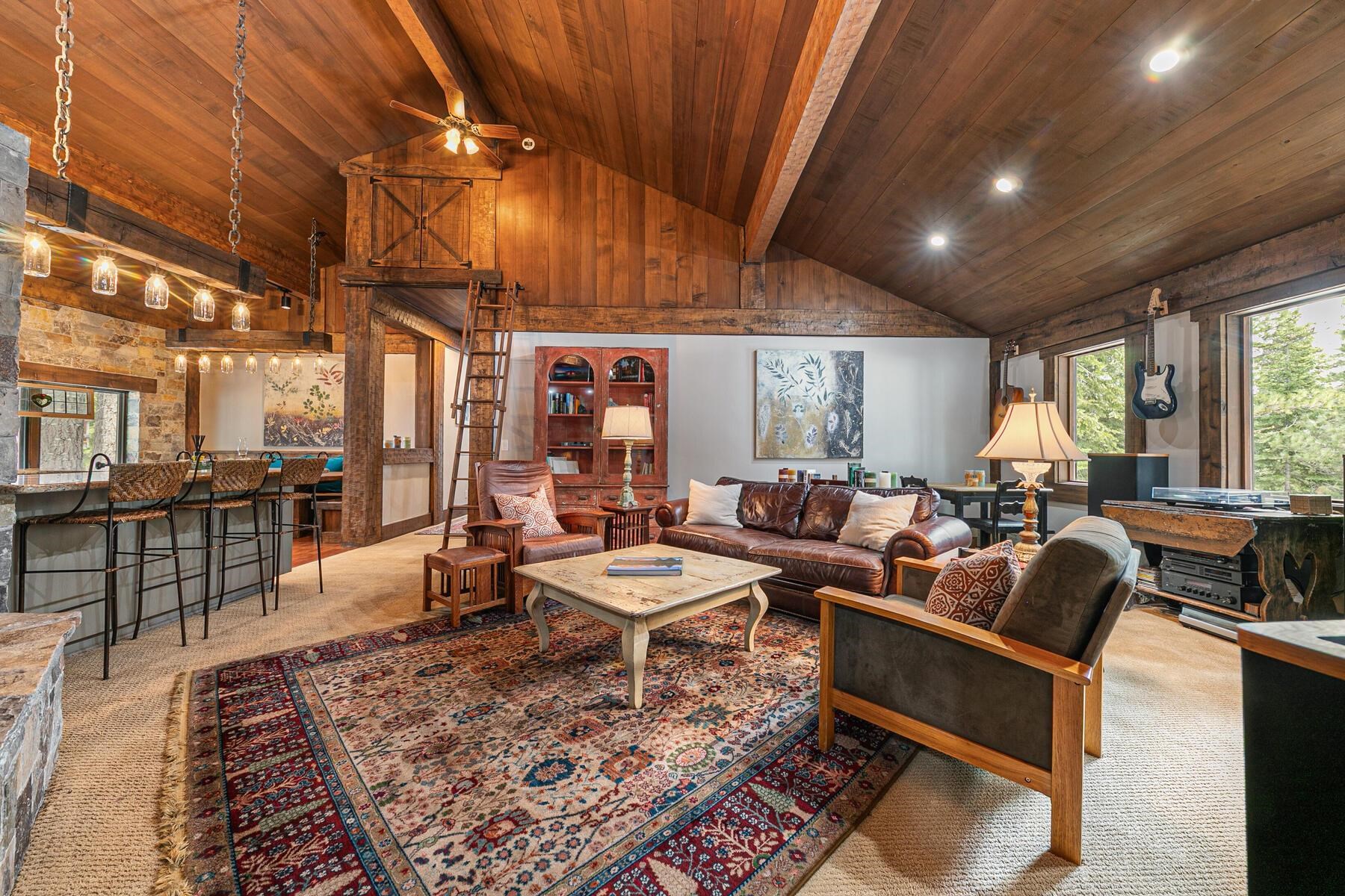 12209 Greenleaf Way Truckee, CA 96161 - Photo 8 of 28 a living room with lots of furniture and a table