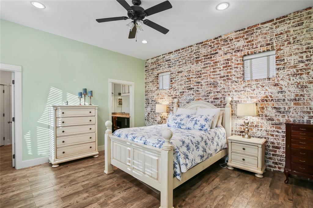 125 George Owens Road Ponder, TX 76259 - Photo 12 of 37 a bedroom with a bed and a dresser