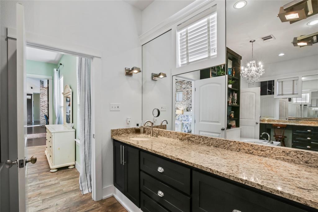 125 George Owens Road Ponder, TX 76259 - Photo 14 of 37 a bathroom with a granite countertop sink mirror and double