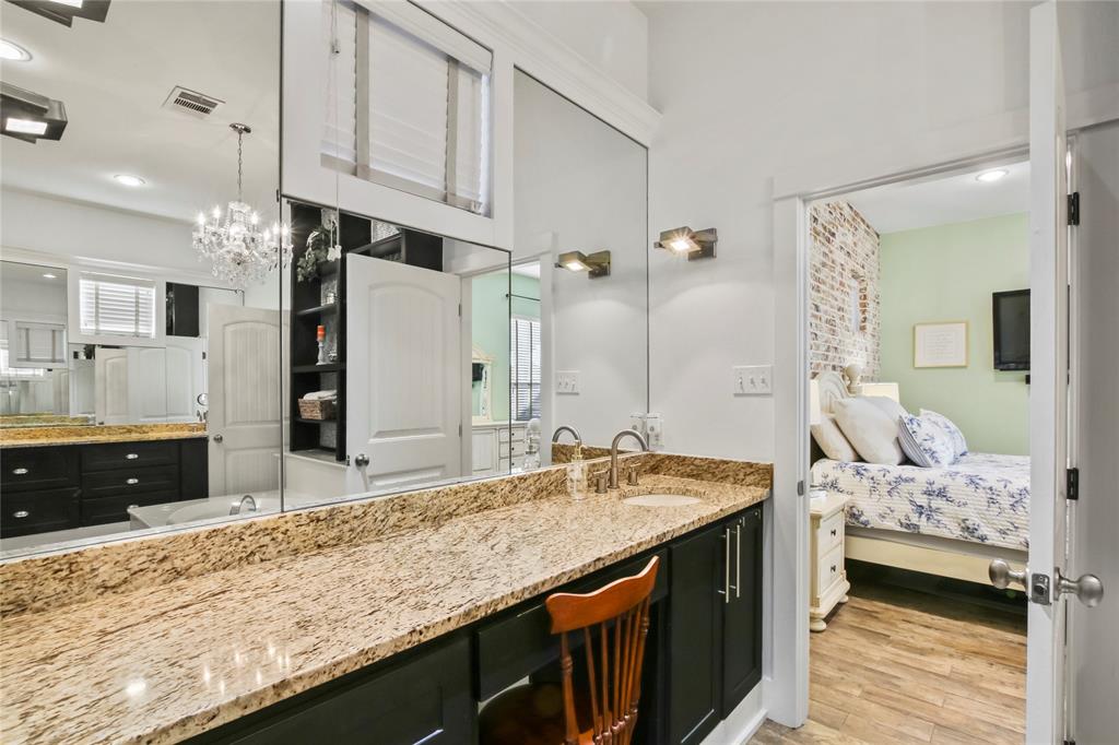 125 George Owens Road Ponder, TX 76259 - Photo 15 of 37 a bathroom with a granite countertop sink and a mirror