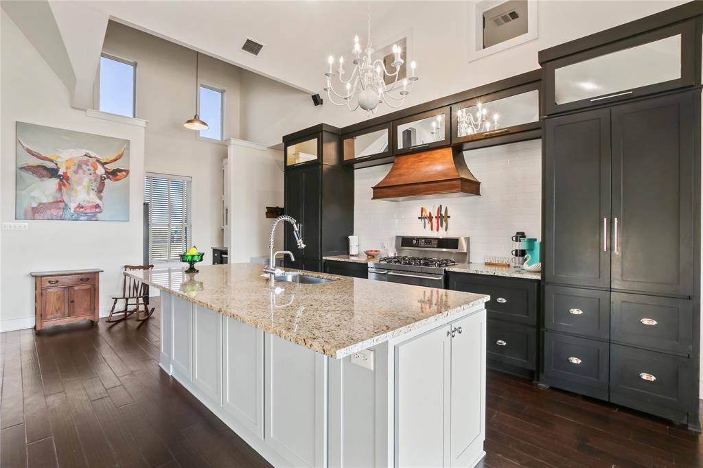 125 George Owens Road Ponder, TX 76259 - Photo 17 of 37 a kitchen with stainless steel appliances granite countertop a sink stove and refrigerator