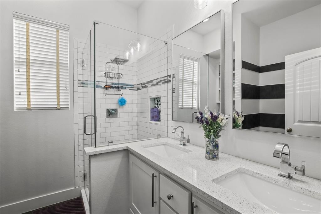 125 George Owens Road Ponder, TX 76259 - Photo 18 of 37 a bathroom with a sink and a mirror