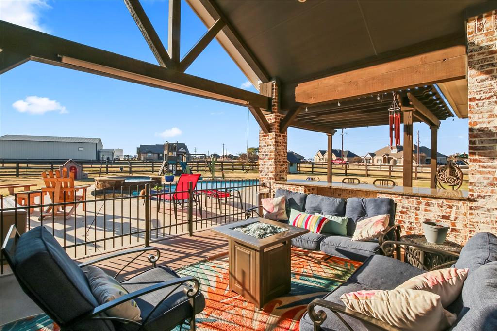 125 George Owens Road Ponder, TX 76259 - Photo 24 of 37 a view of a balcony with furniture