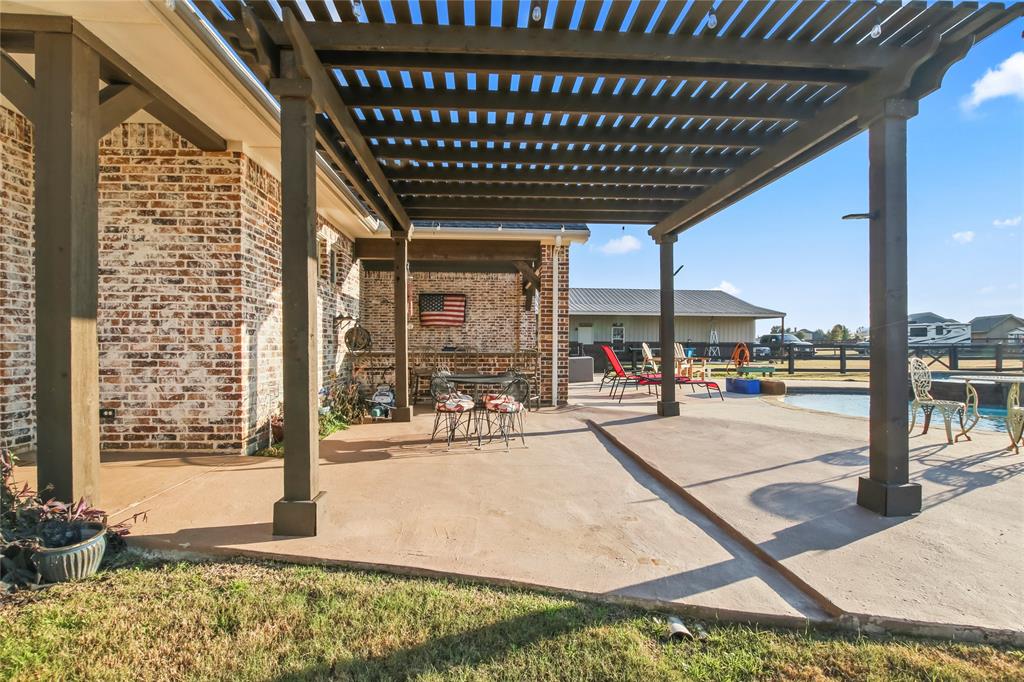 125 George Owens Road Ponder, TX 76259 - Photo 25 of 37 a view of a hall with floor to ceiling windows