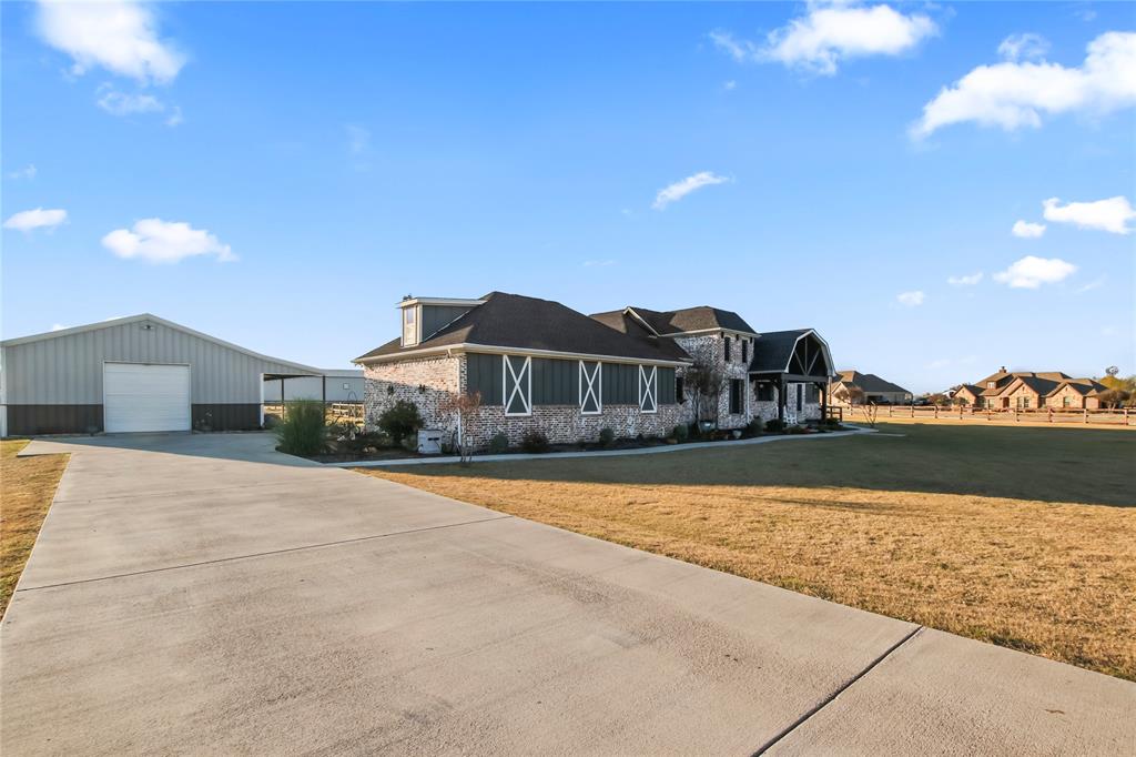 125 George Owens Road Ponder, TX 76259 - Photo 28 of 37 a front view of a house with a yard and mountain view