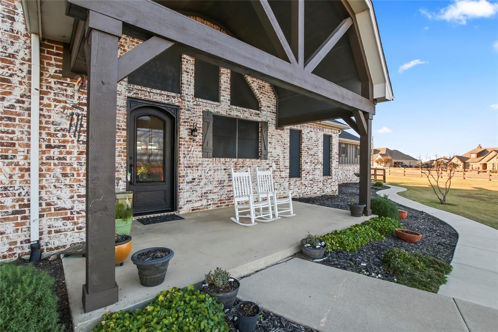125 George Owens Road Ponder, TX 76259 - Photo 31 of 37 a front view of a house with outdoor seating