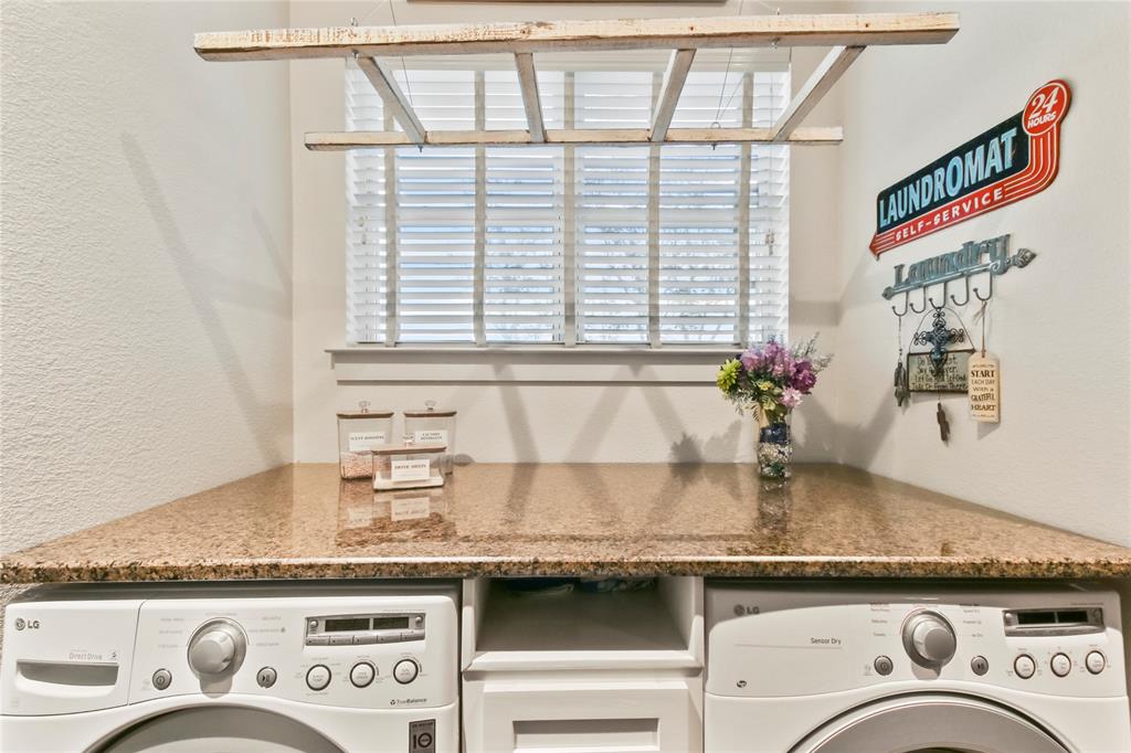125 George Owens Road Ponder, TX 76259 - Photo 8 of 37 a kitchen with granite countertop a sink and a stove