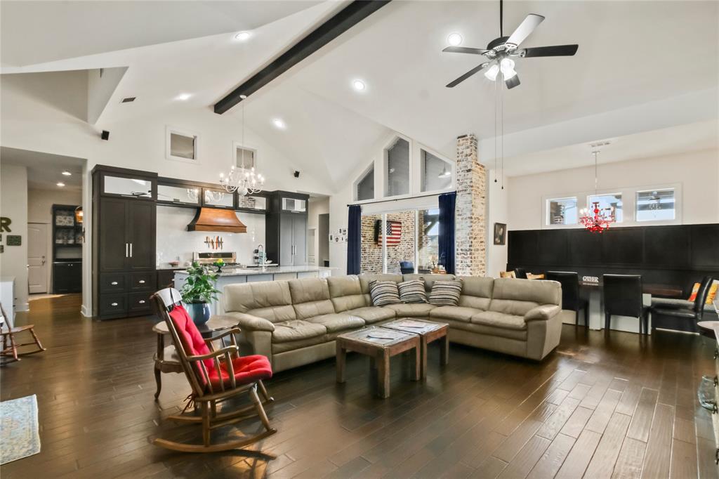 125 George Owens Road Ponder, TX 76259 - Photo 9 of 37 a living room with furniture a fireplace and a flat screen tv