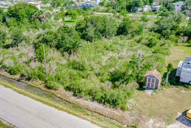 a view of a yard with an outdoor seating