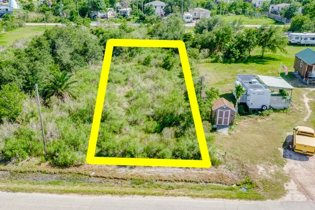 an aerial view of a house with yard swimming pool and outdoor seating