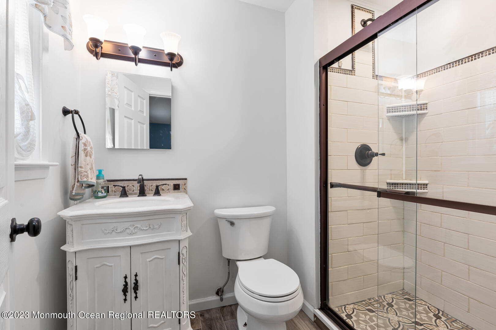 9 Schelly Drive Middletown, NJ 07748 - Photo 16 of 25 a bathroom with a sink toilet and shower