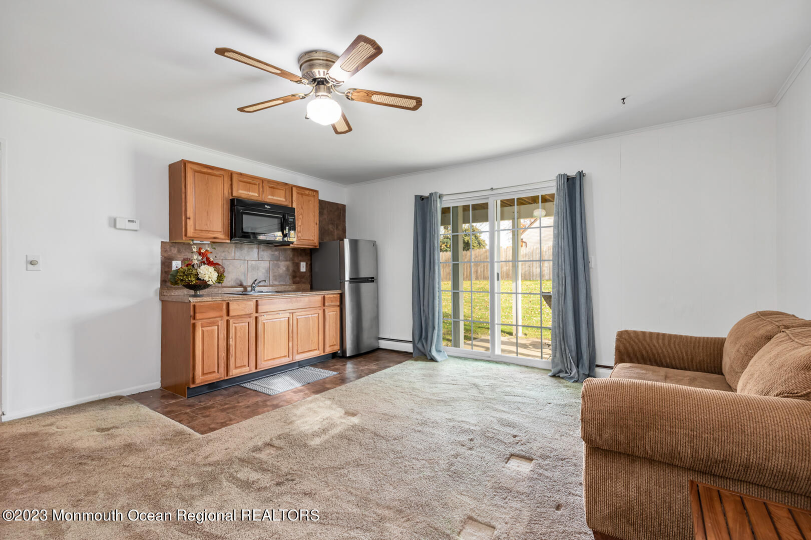 9 Schelly Drive Middletown, NJ 07748 - Photo 21 of 25 a living room with furniture and a flat screen tv