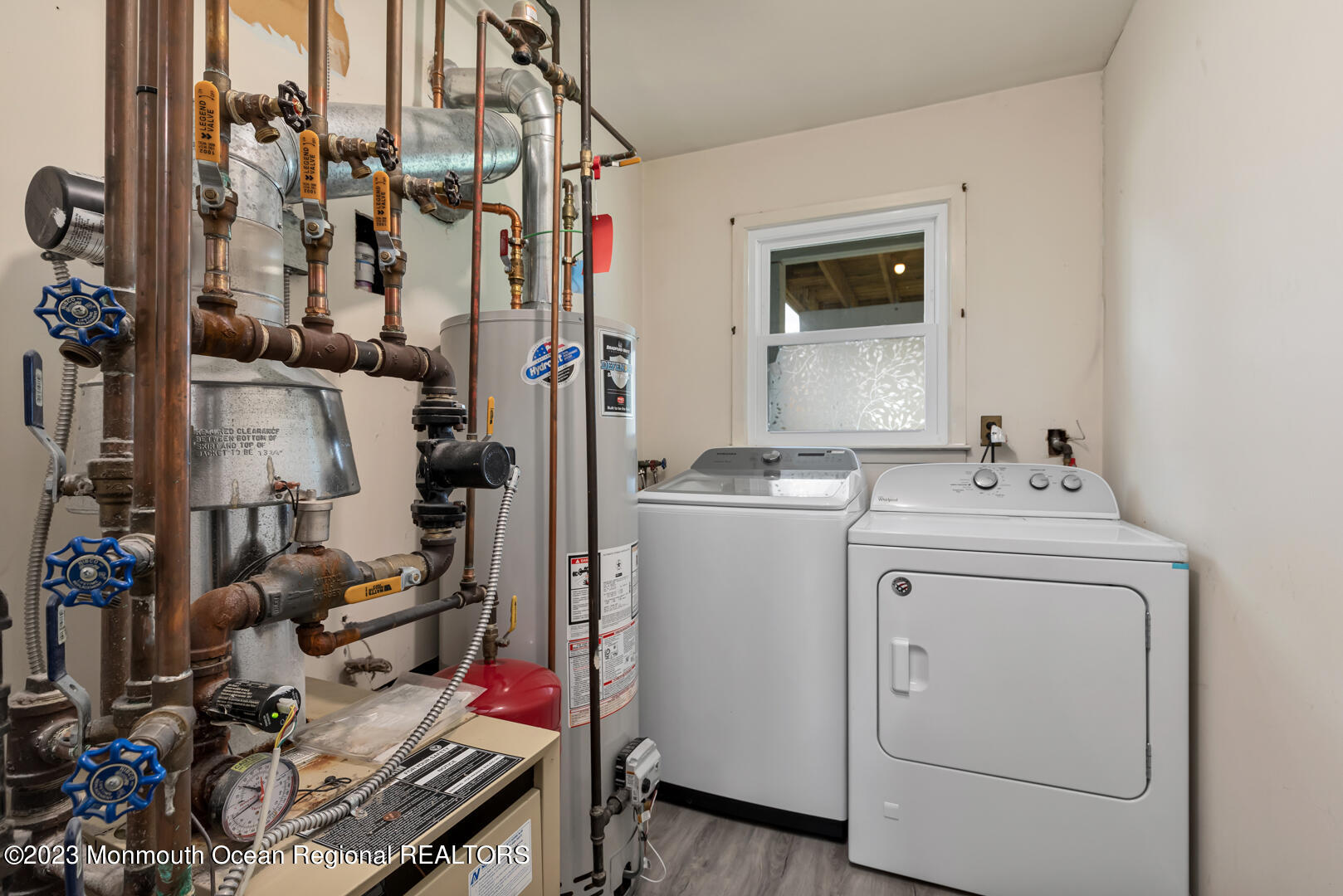 9 Schelly Drive Middletown, NJ 07748 - Photo 23 of 25 a storage room with washer and dryer