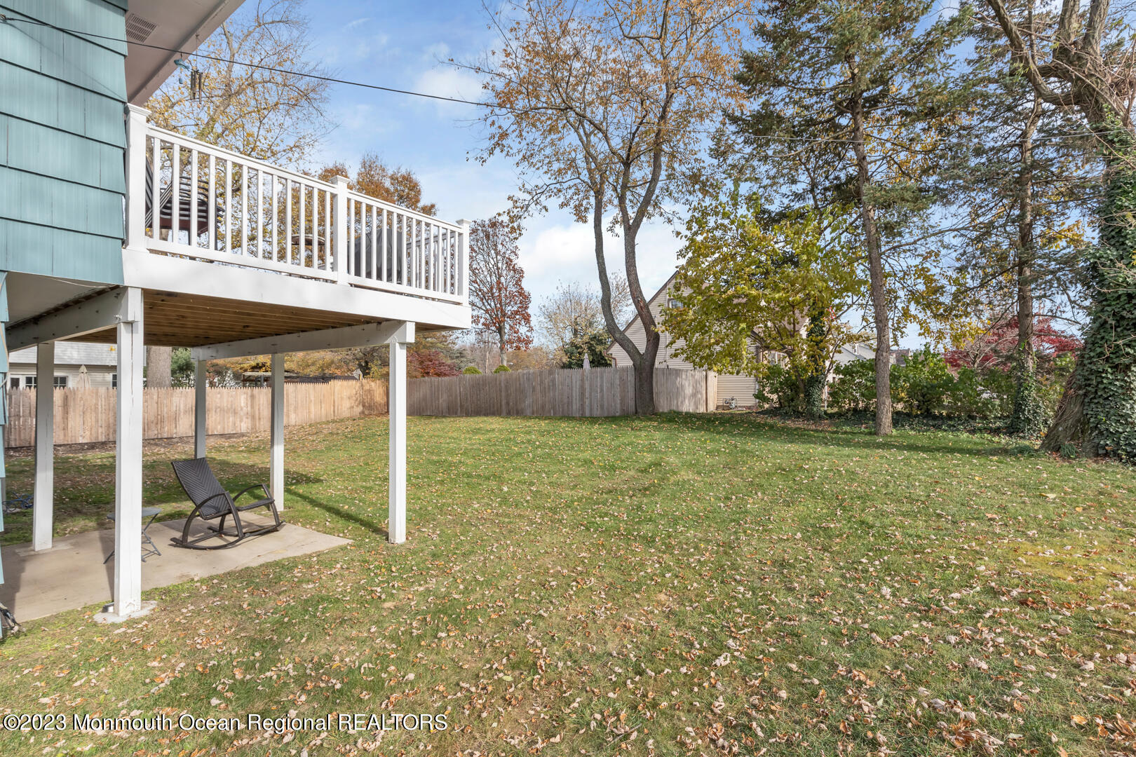 9 Schelly Drive Middletown, NJ 07748 - Photo 25 of 25 a backyard of a house with table and chairs