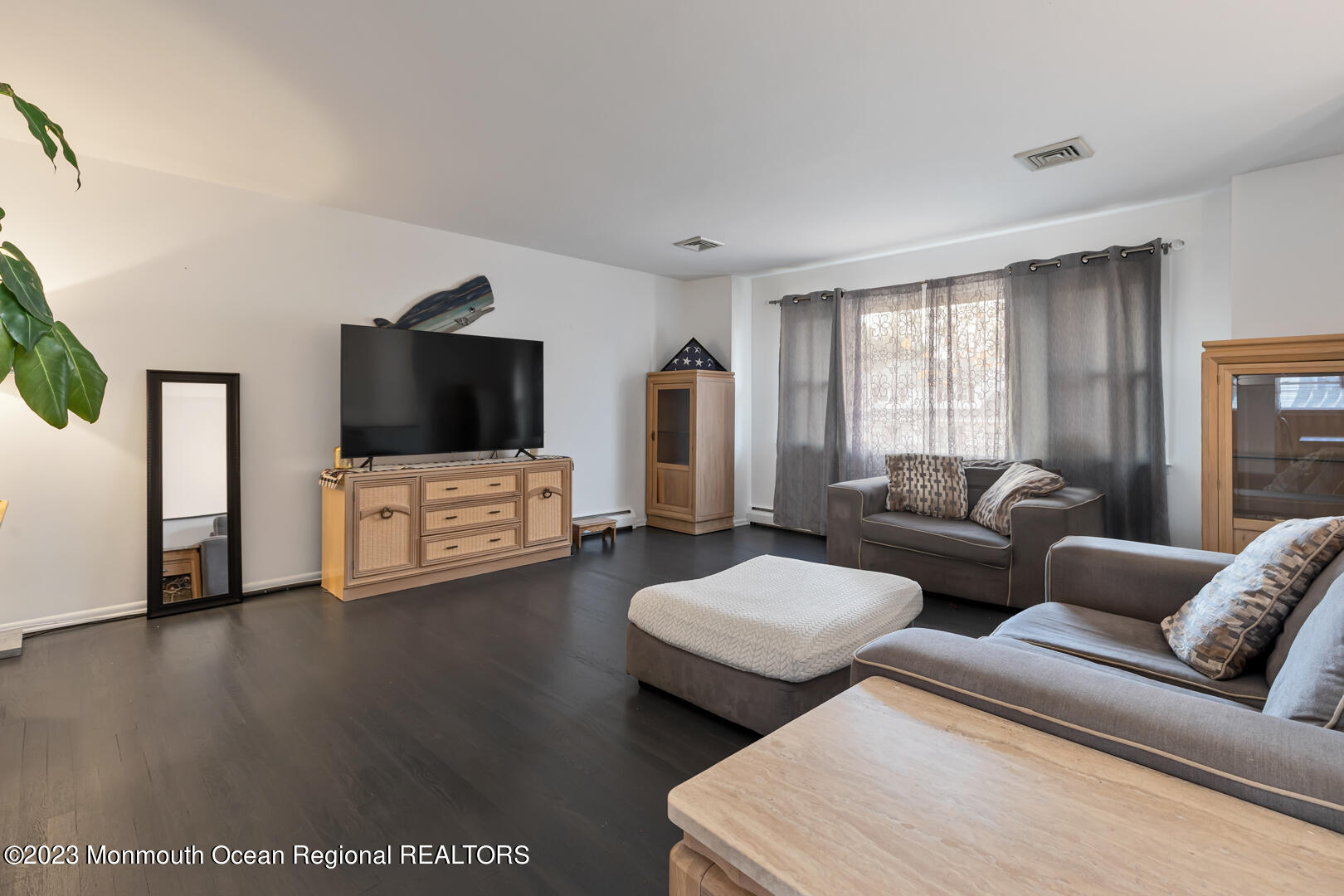 9 Schelly Drive Middletown, NJ 07748 - Photo 4 of 25 a living room with furniture and a flat screen tv