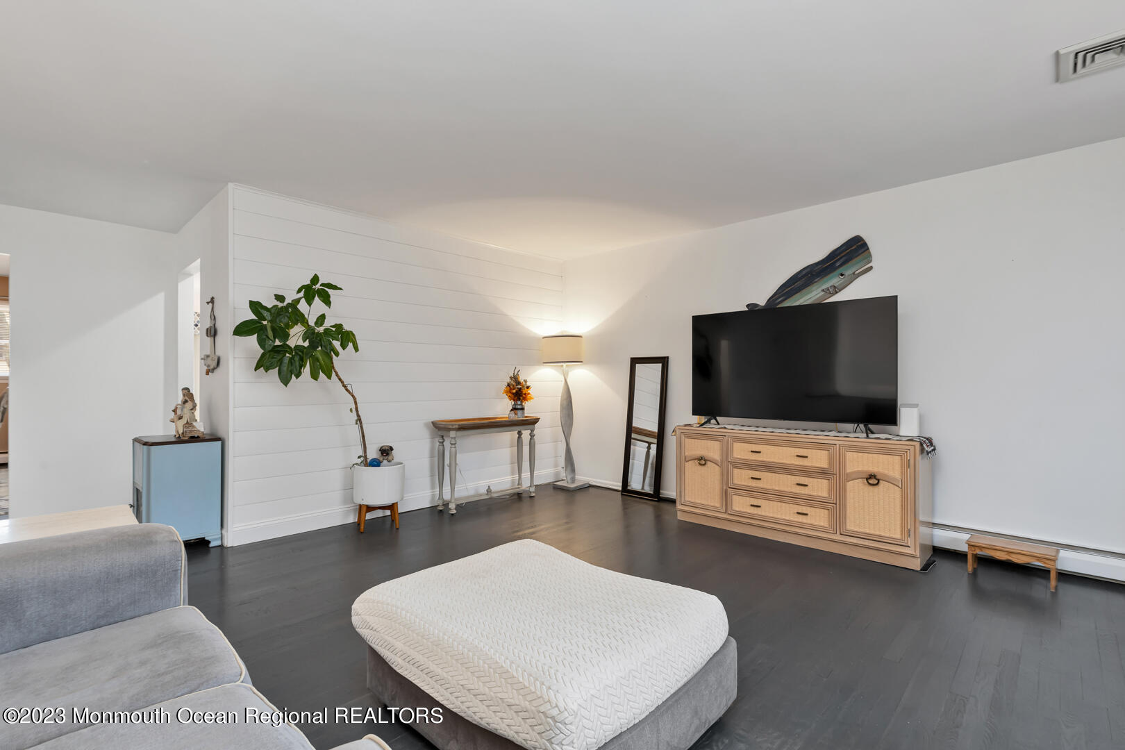 9 Schelly Drive Middletown, NJ 07748 - Photo 6 of 25 a living room with furniture and a flat screen tv
