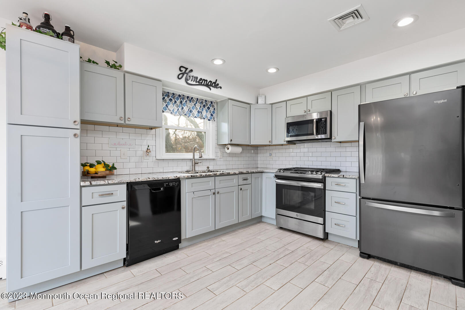 9 Schelly Drive Middletown, NJ 07748 - Photo 7 of 25 a kitchen with a refrigerator stove and microwave
