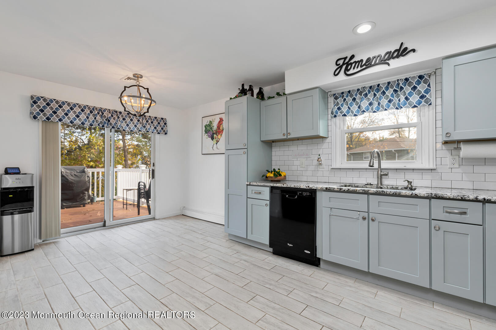9 Schelly Drive Middletown, NJ 07748 - Photo 8 of 25 a kitchen with granite countertop a stove a sink and a refrigerator