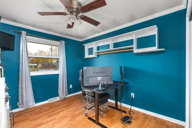 a living room with furniture and kitchen view