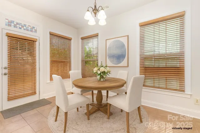 a view of a dining room with furniture and a window
