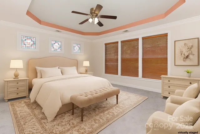 a spacious bedroom with a bed and a large window