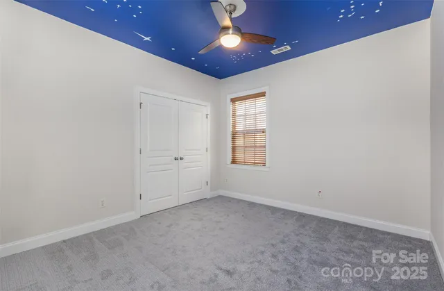 a swimming pool with outdoor seating and yard