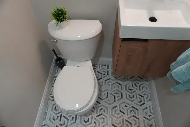 a bathroom with a toilet and a sink