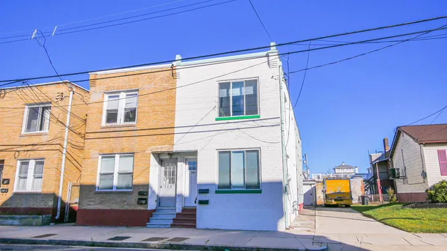 a front view of a building with street view